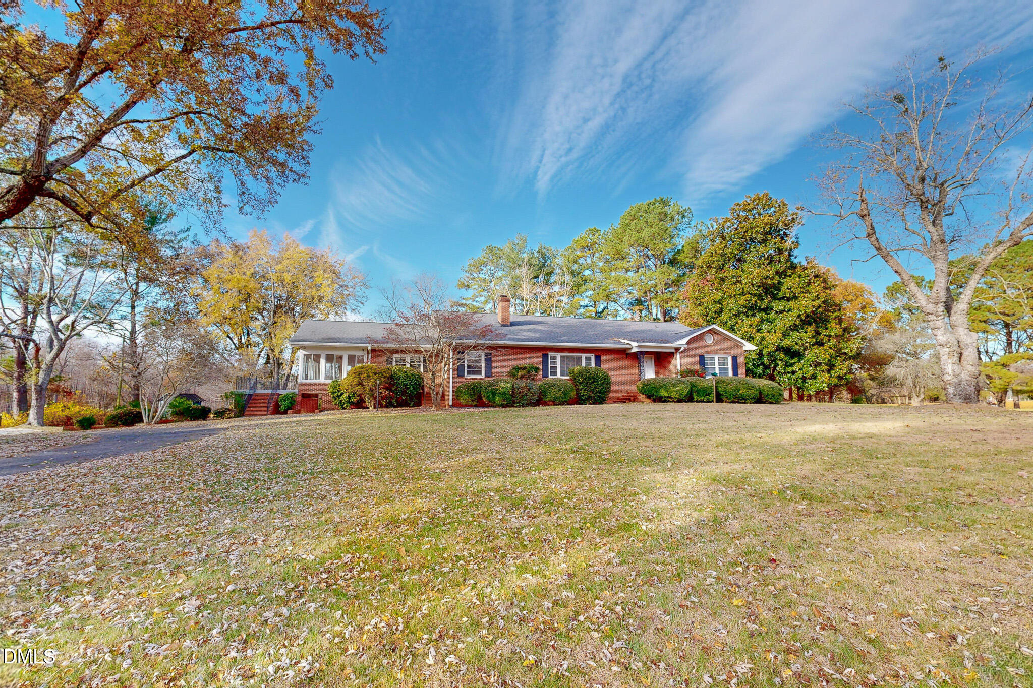 8758 Hurdle Mills Road Hurdle Mills, NC 27541 - Photo 8 of 53 a front view of house with yard and trees around