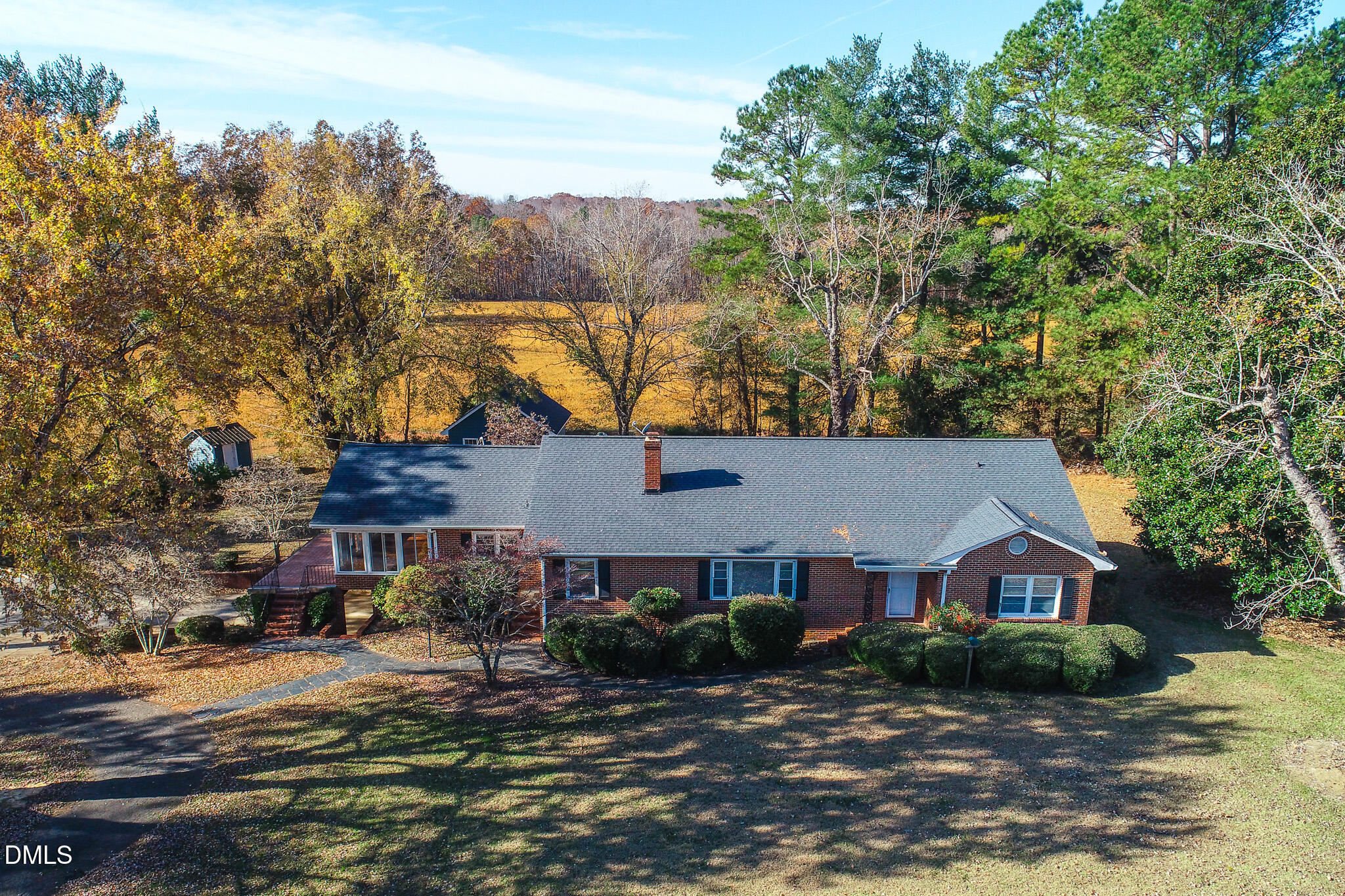8758 Hurdle Mills Road Hurdle Mills, NC 27541 - Photo 10 of 53 a front view of a house with a yard and mountain view in back
