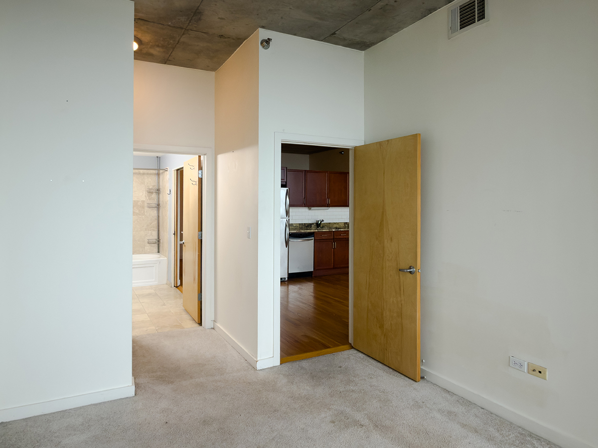1720 South Michigan Avenue, Unit 3002 Chicago, IL 60616 - Photo 11 of 22 a view of a kitchen with refrigerator and a kitchen