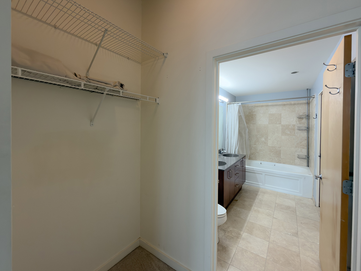 1720 South Michigan Avenue, Unit 3002 Chicago, IL 60616 - Photo 13 of 22 a bathroom with a granite countertop sink a toilet and shower
