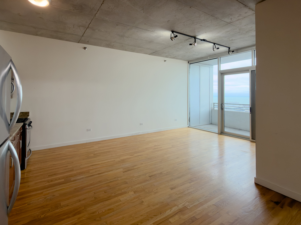1720 South Michigan Avenue, Unit 3002 Chicago, IL 60616 - Photo 9 of 22 a view of a room with wooden floor