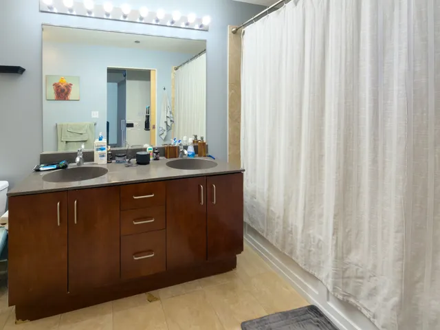 a bathroom with a toilet a sink and a mirror