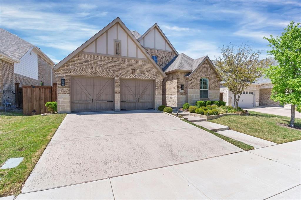 1928 Crested Ridge Road Fort Worth, TX 76008 - Photo 1 of 29 a front view of a house with a yard and garage
