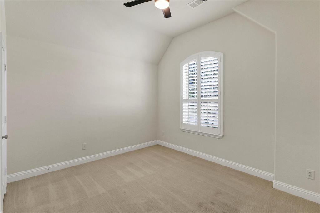 1928 Crested Ridge Road Fort Worth, TX 76008 - Photo 17 of 29 an empty room with a window