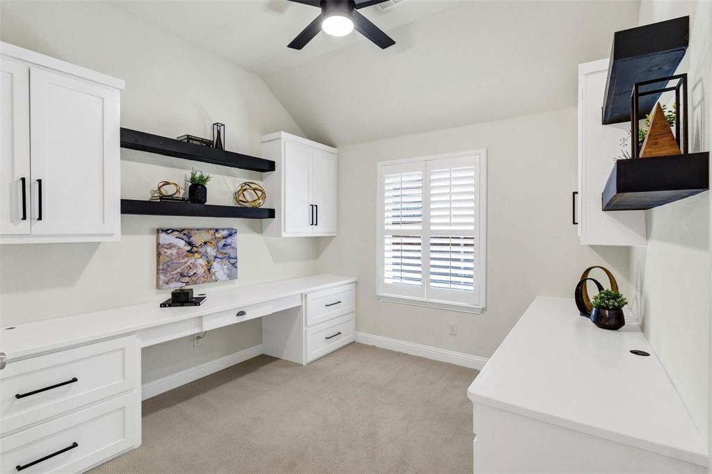1928 Crested Ridge Road Fort Worth, TX 76008 - Photo 19 of 29 a kitchen with white cabinets and window