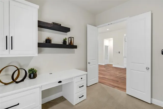 a view of white cabinets and washer dryer