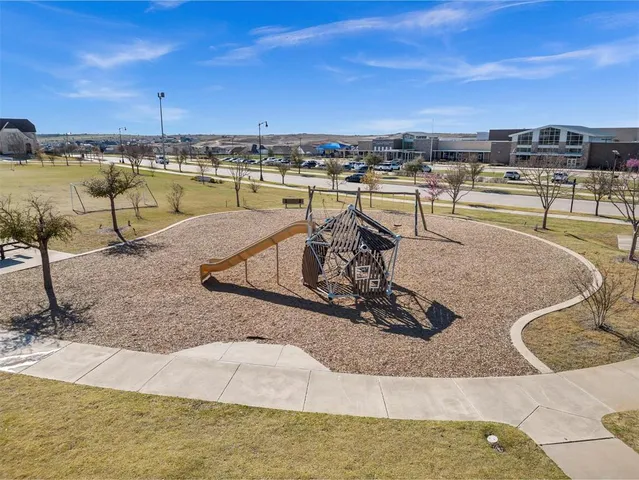 a view of a swimming pool with a table and chairs