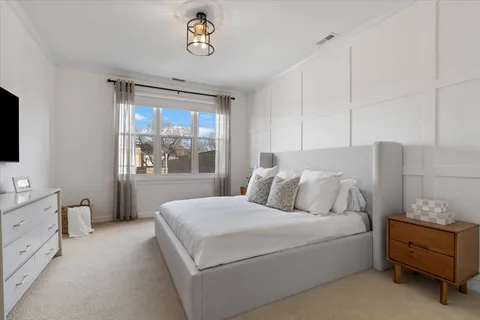 a bed room with a bed and a window