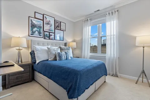 a bedroom with a bed and window