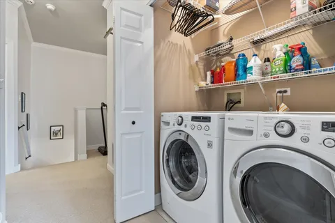 a view of hallway with washer and dryer
