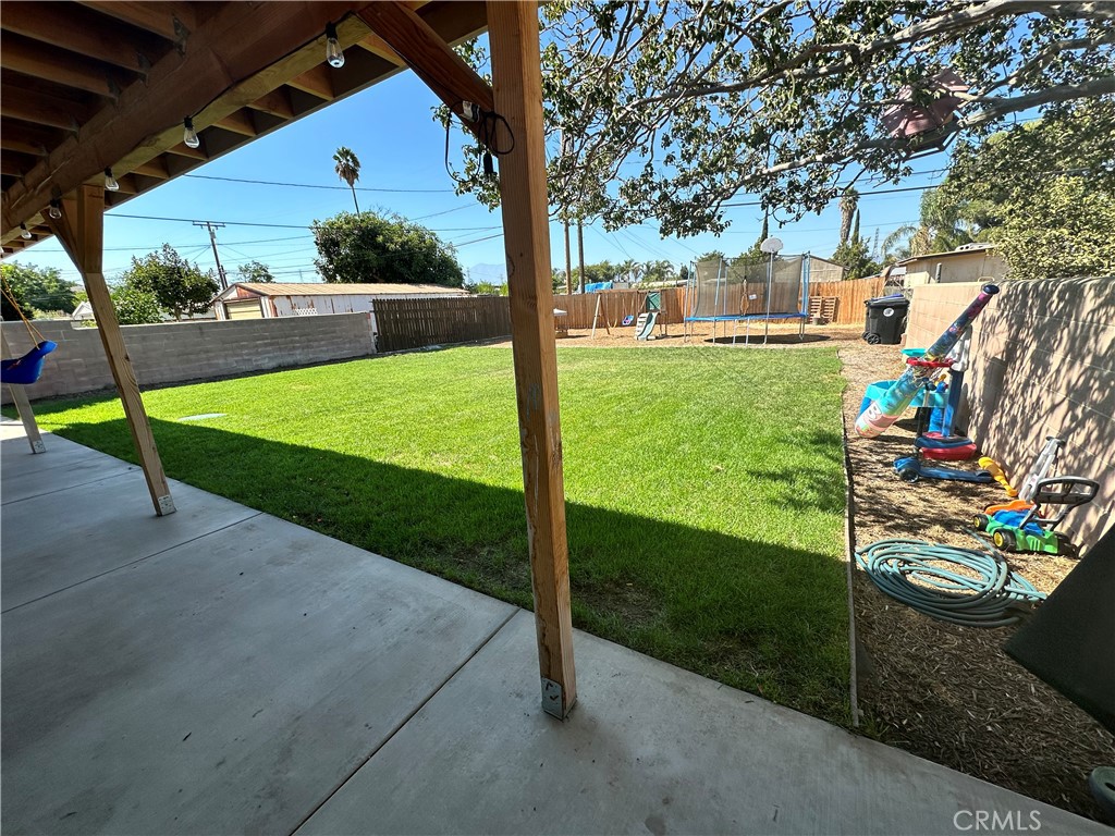 18470 7th Street Bloomington, CA 92316 - Photo 34 of 45 a view of a house with backyard and a tree