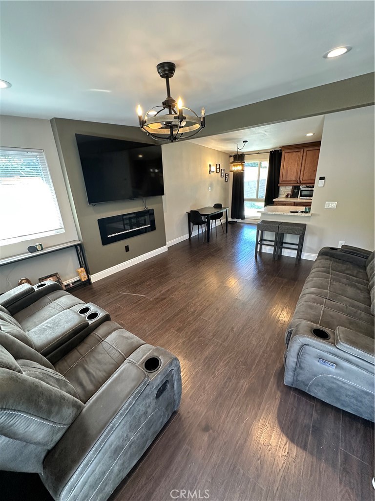 18470 7th Street Bloomington, CA 92316 - Photo 5 of 45 a living room with furniture and a flat screen tv