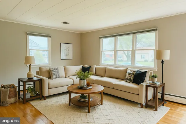 a living room with furniture and a large window