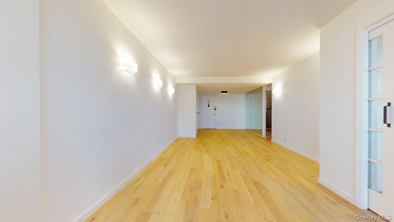 118-17 Union Turnpike, Unit 18H Queens, NY 11375 - Photo 11 of 49 Hall with light wood finished floors