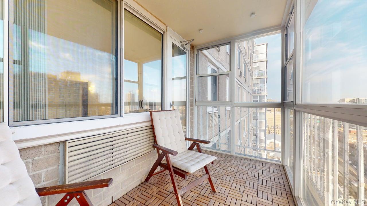 118-17 Union Turnpike, Unit 18H Queens, NY 11375 - Photo 39 of 49 Sunroom / solarium with a view of city