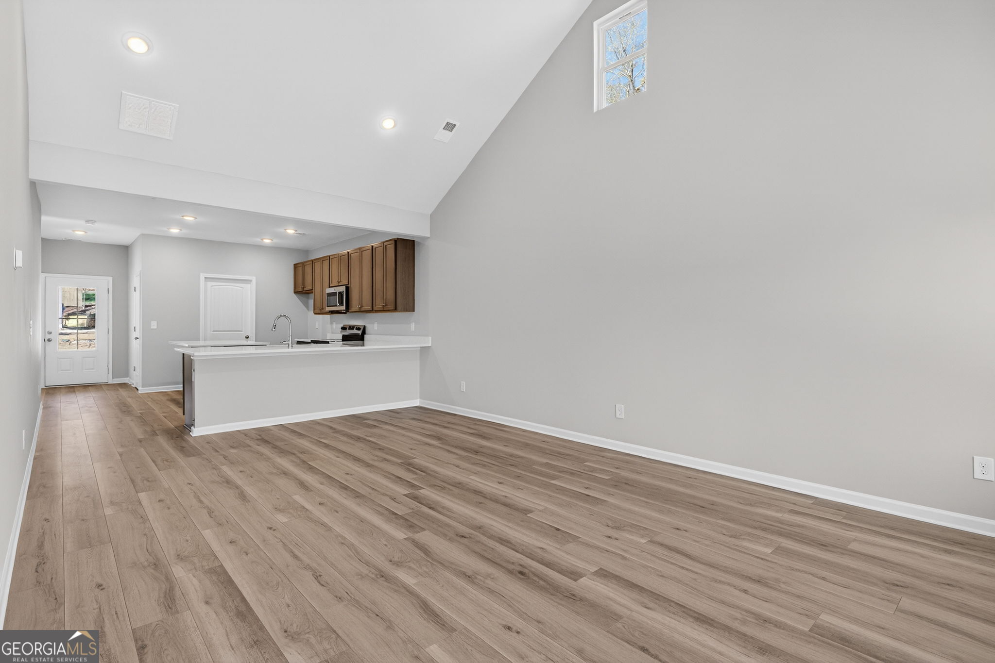 468 South Bolee Road Hogansville, GA 30230 - Photo 12 of 25 a view of a kitchen with wooden floor and a sink