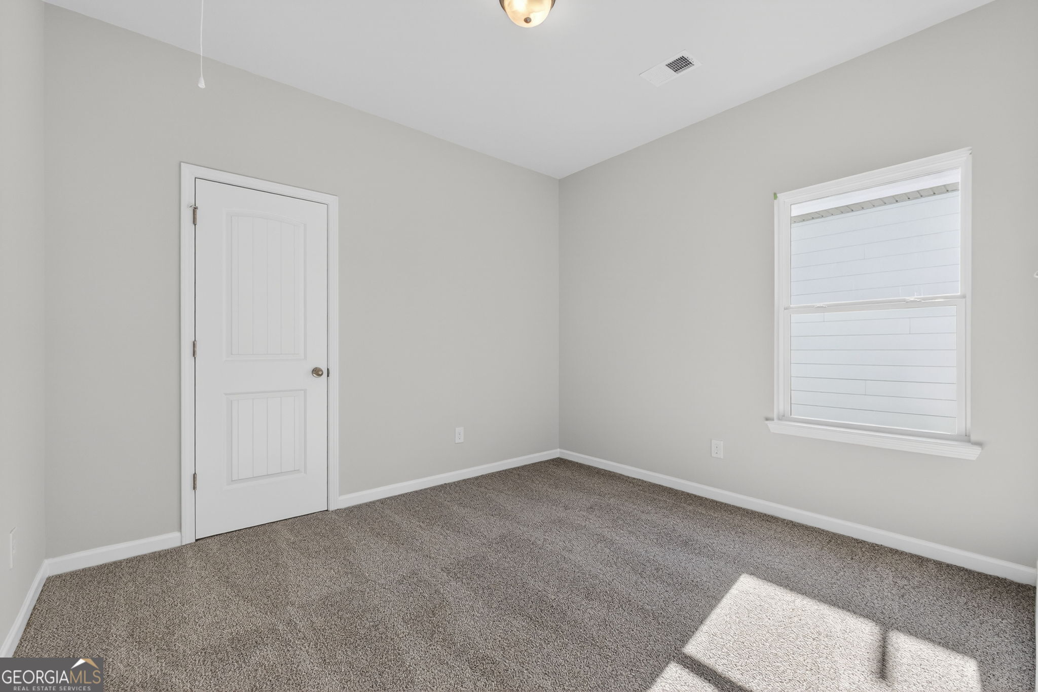 468 South Bolee Road Hogansville, GA 30230 - Photo 22 of 25 an empty room with a window