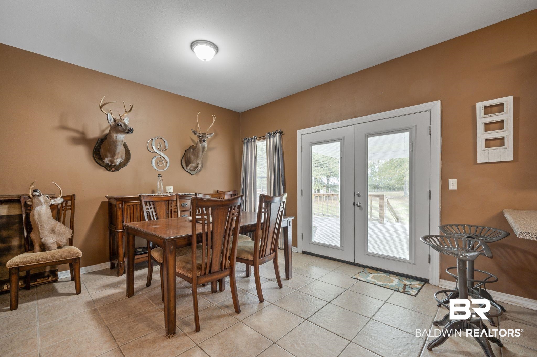 9539 Lakeview Road Bay Minette, AL 36507 - Photo 12 of 45 Tiled dining space featuring french doors