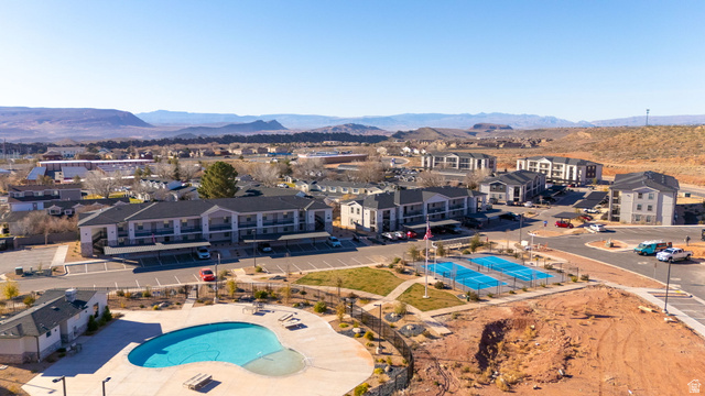 6231 Winding Way, Unit K105 Hurricane, UT 84737 - Photo 19 of 20 Aerial view of residential area with a pool area and a mountain backdrop