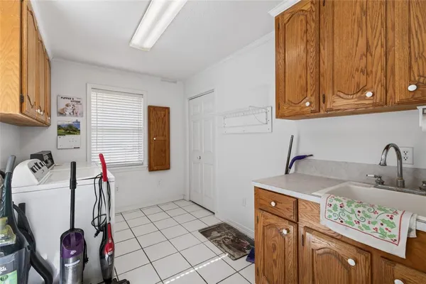 a bathroom with a sink and a washing machine