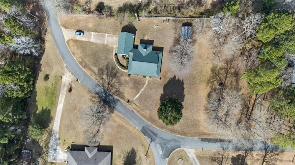 an aerial view of a house with outdoor space