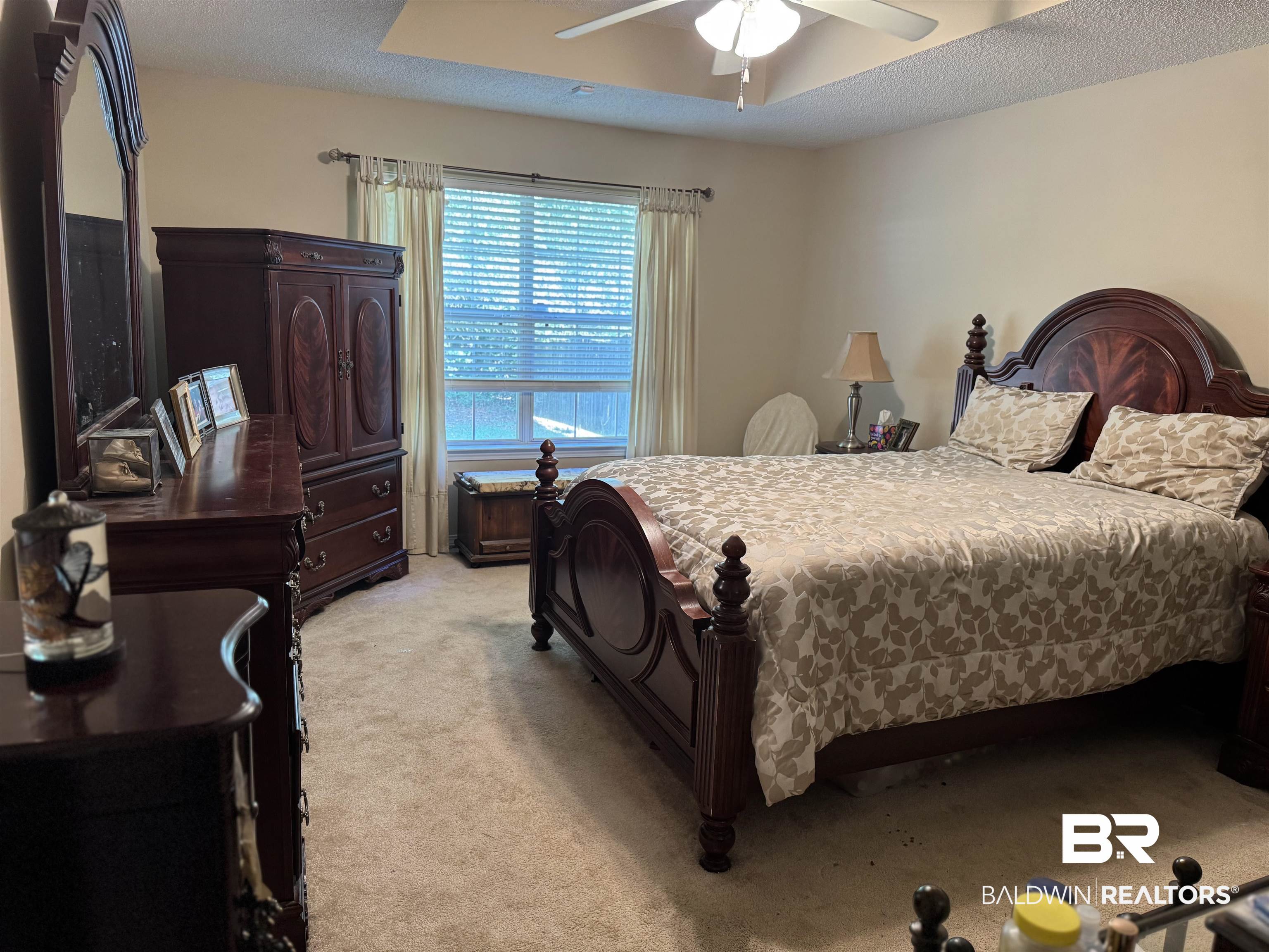 2245 Spring Grove North Mobile, AL 36695 - Photo 8 of 10 Bedroom with light colored carpet, a textured ceiling, and a ceiling fan