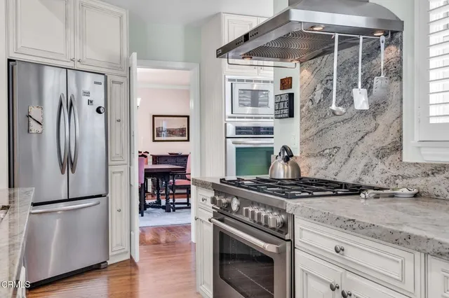 a spacious bathroom with a tub sink and mirror