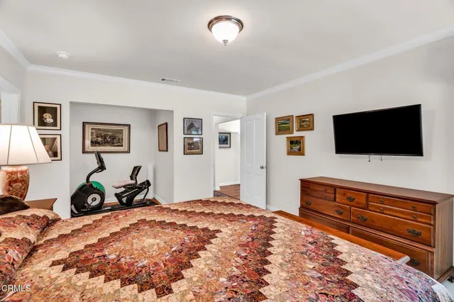 a bedroom with bed and a window