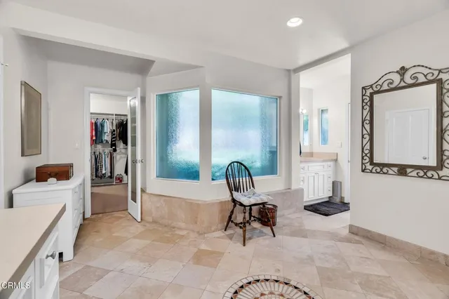 a kitchen with a refrigerator and window