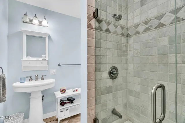 a view of a backyard with large trees and plants