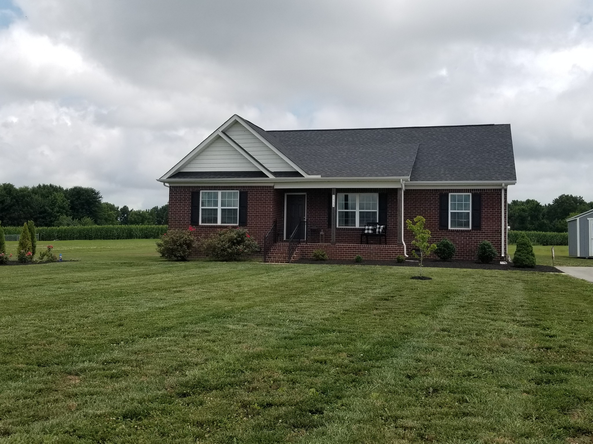 145 A T G T Road Portland, TN 37148 - Photo 2 of 41 a front view of a house with a garden