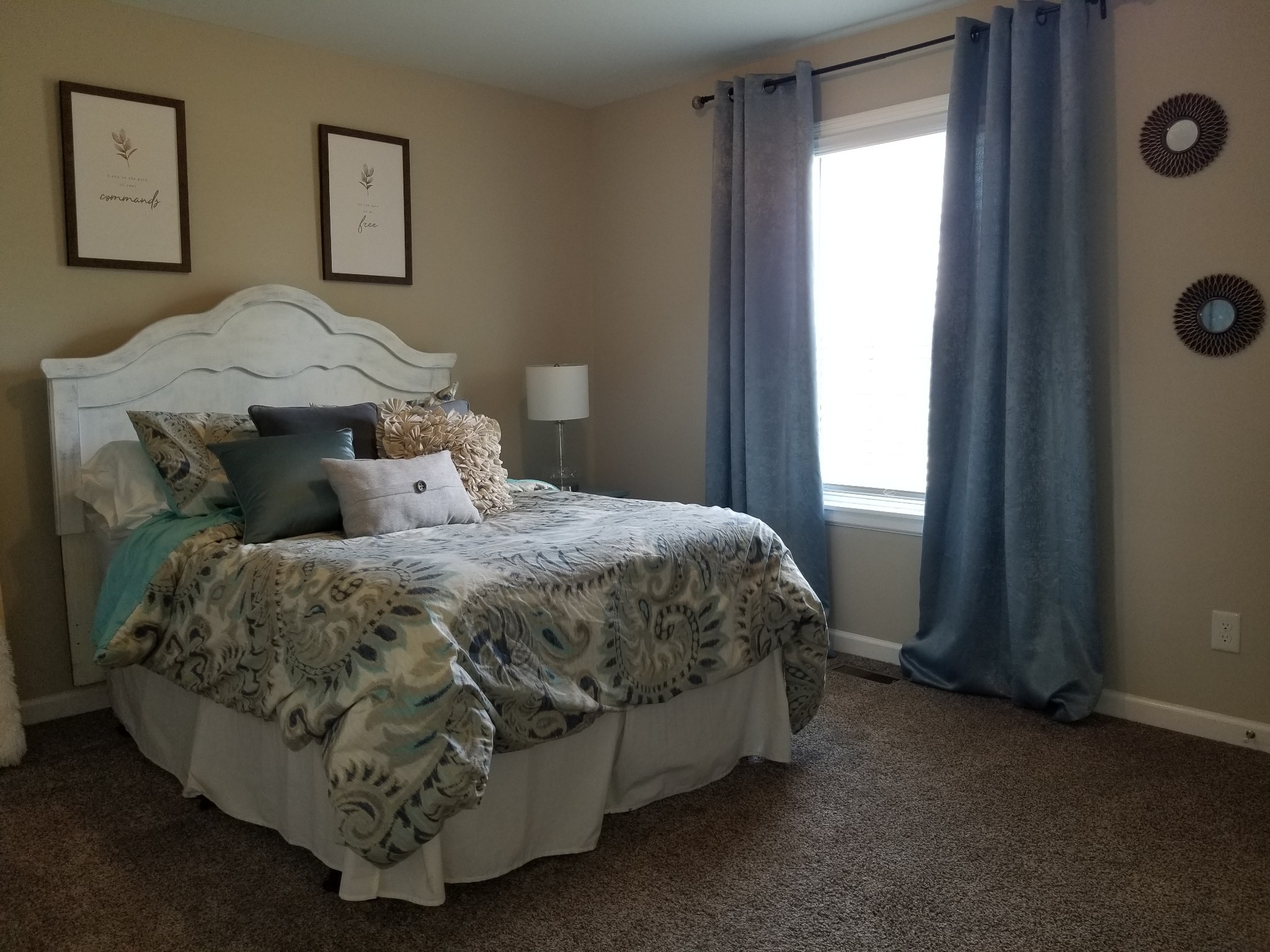 145 A T G T Road Portland, TN 37148 - Photo 27 of 41 a bed sitting in a bedroom next to a window and a tv
