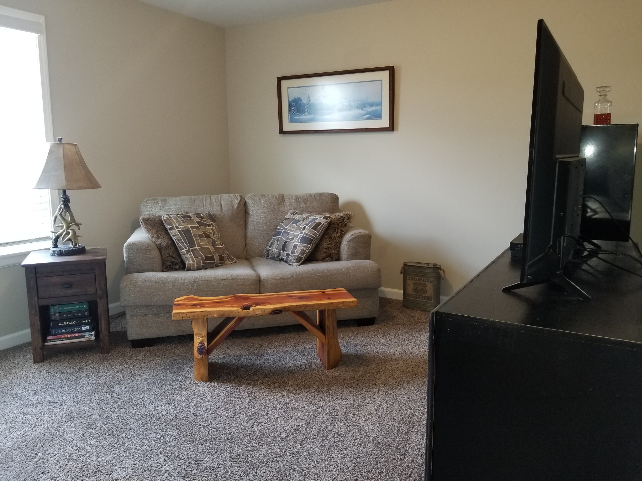 145 A T G T Road Portland, TN 37148 - Photo 30 of 41 a living room with furniture and a flat screen tv