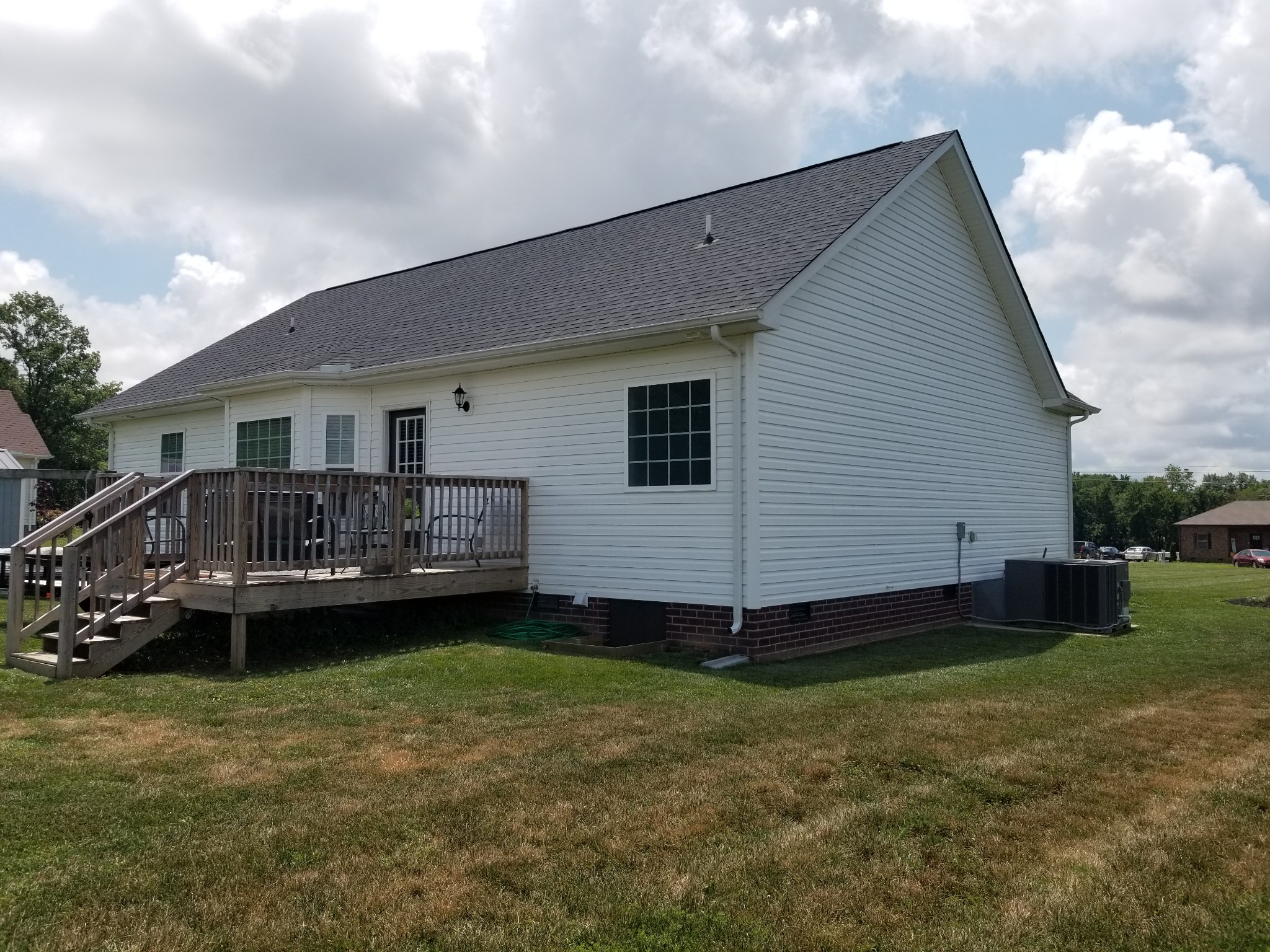 145 A T G T Road Portland, TN 37148 - Photo 33 of 41 a view of a house with a backyard and deck