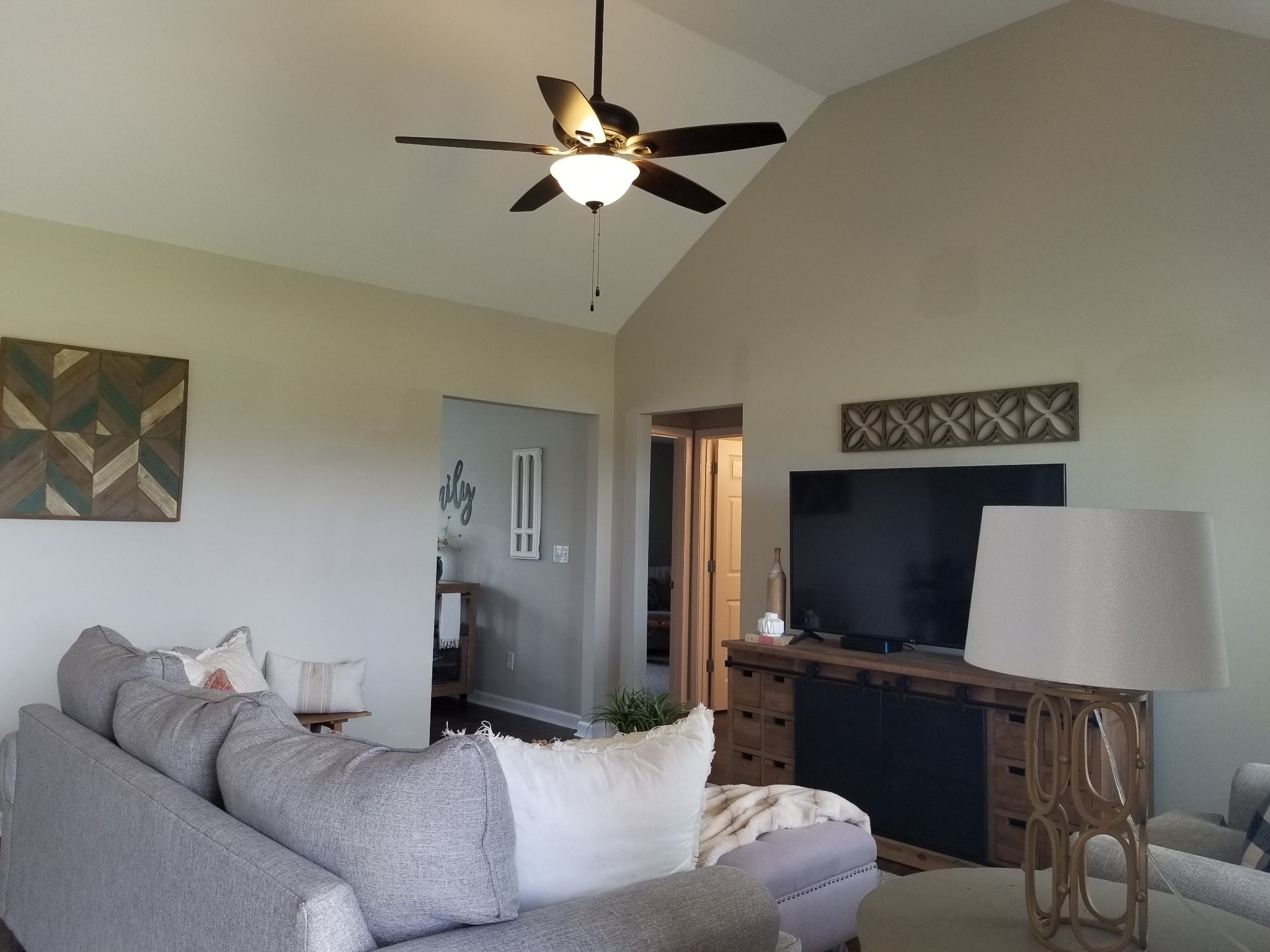 145 A T G T Road Portland, TN 37148 - Photo 7 of 41 a living room with furniture a ceiling fan and a flat screen tv