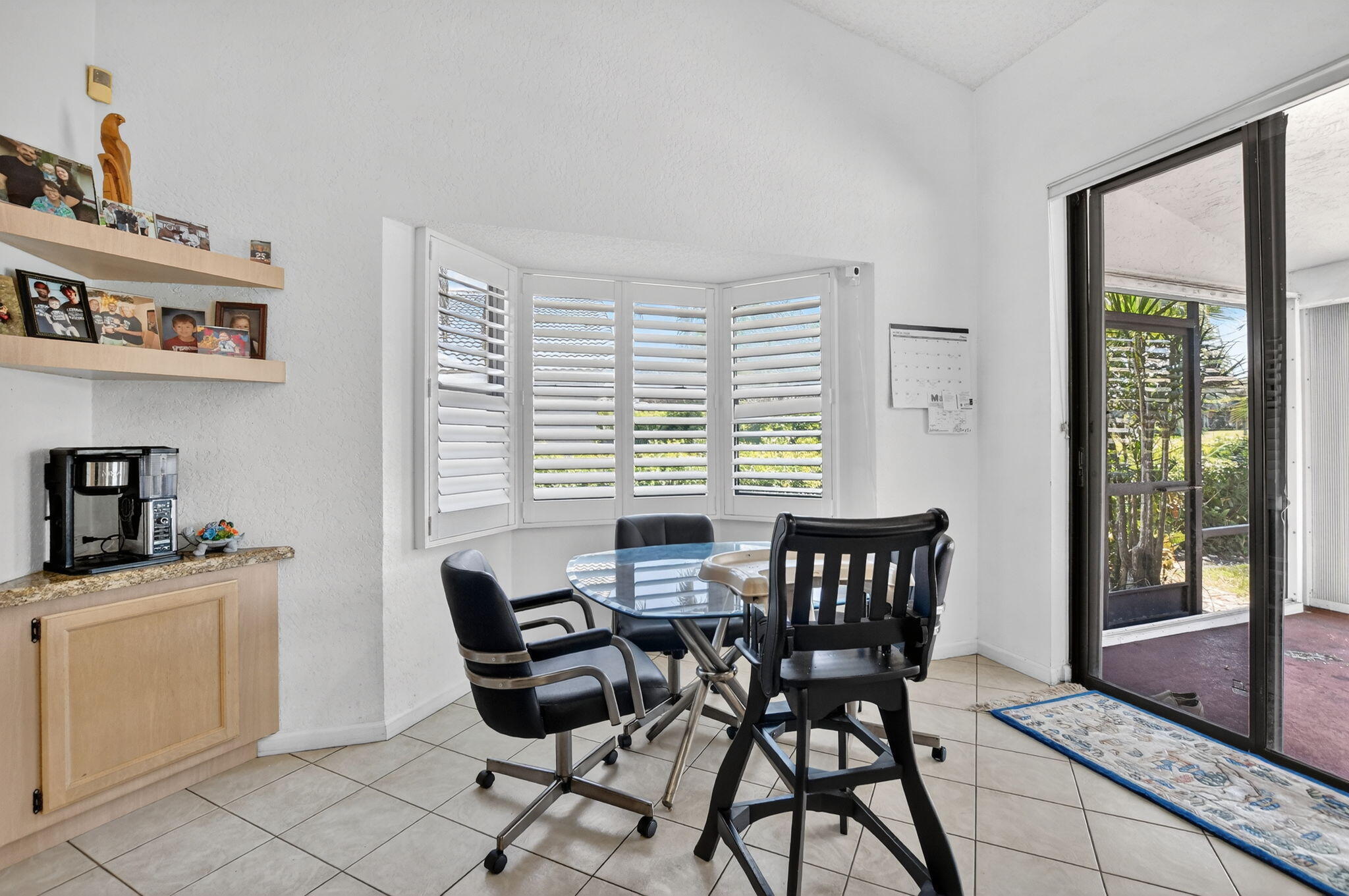 10226 Fresh Meadow Lane Boca Raton, FL 33498 - Photo 15 of 58 a dining room with furniture and window