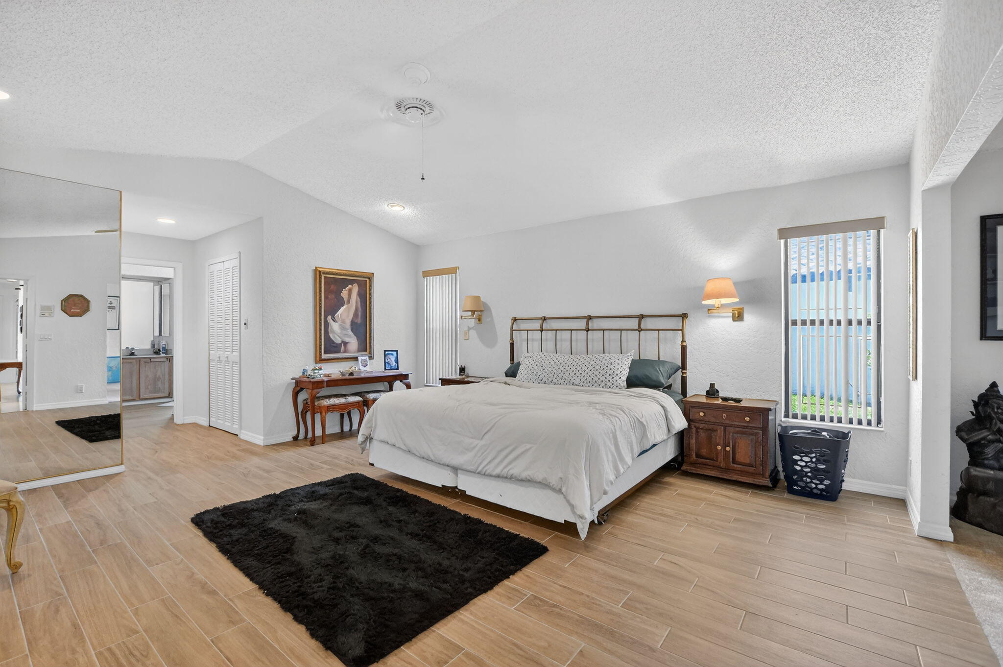 10226 Fresh Meadow Lane Boca Raton, FL 33498 - Photo 19 of 58 a bedroom with double bed and a window