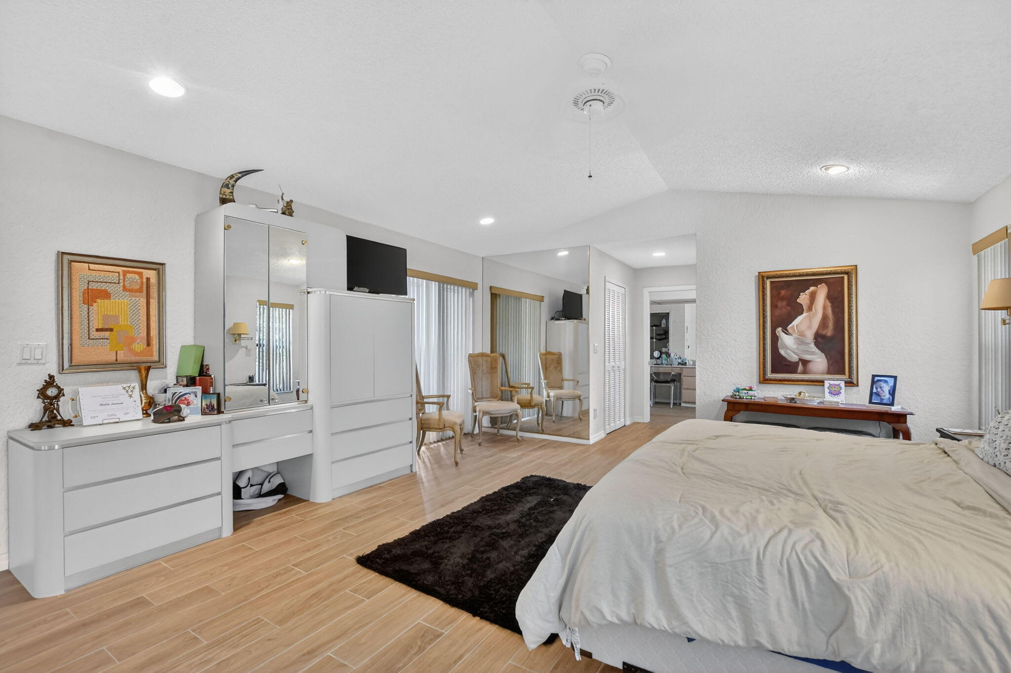 10226 Fresh Meadow Lane Boca Raton, FL 33498 - Photo 20 of 58 a bed room with a bed and a view of living room