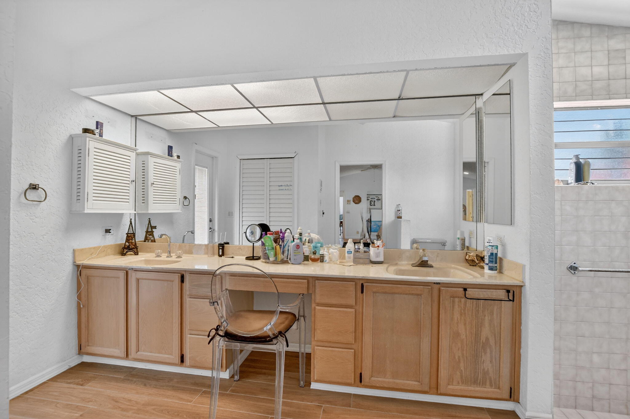 10226 Fresh Meadow Lane Boca Raton, FL 33498 - Photo 25 of 58 a room with a sink chairs and chandelier