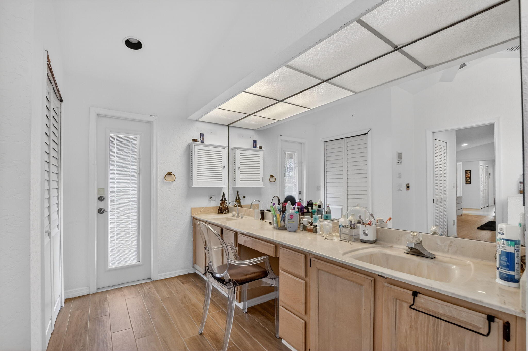 10226 Fresh Meadow Lane Boca Raton, FL 33498 - Photo 28 of 58 a bathroom with a sink double vanity granite and a mirror