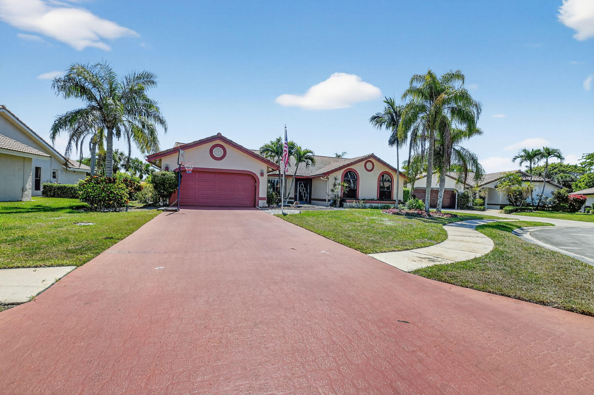10226 Fresh Meadow Lane Boca Raton, FL 33498 - Photo 4 of 58 a front view of a house with yard and green space