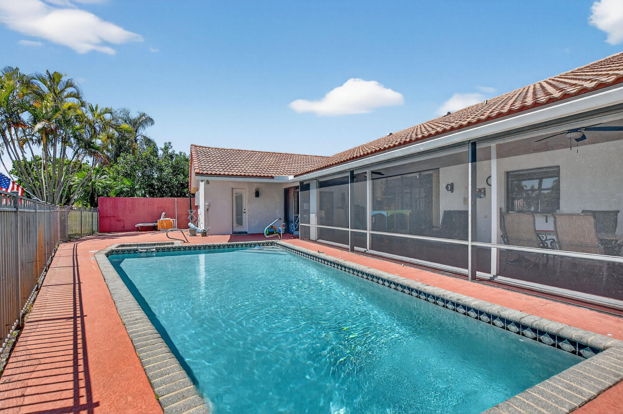 10226 Fresh Meadow Lane Boca Raton, FL 33498 - Photo 41 of 58 a view of a backyard with a small pool