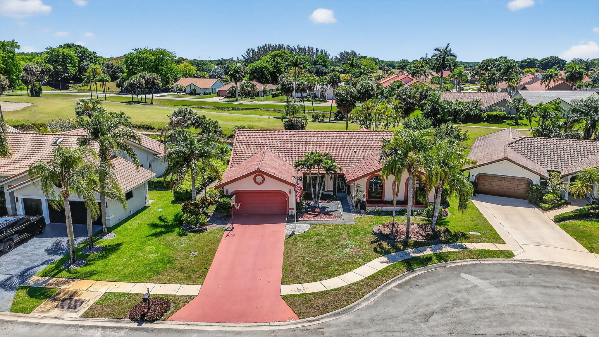 10226 Fresh Meadow Lane Boca Raton, FL 33498 - Photo 48 of 58 an aerial view of a house with a garden and swimming pool