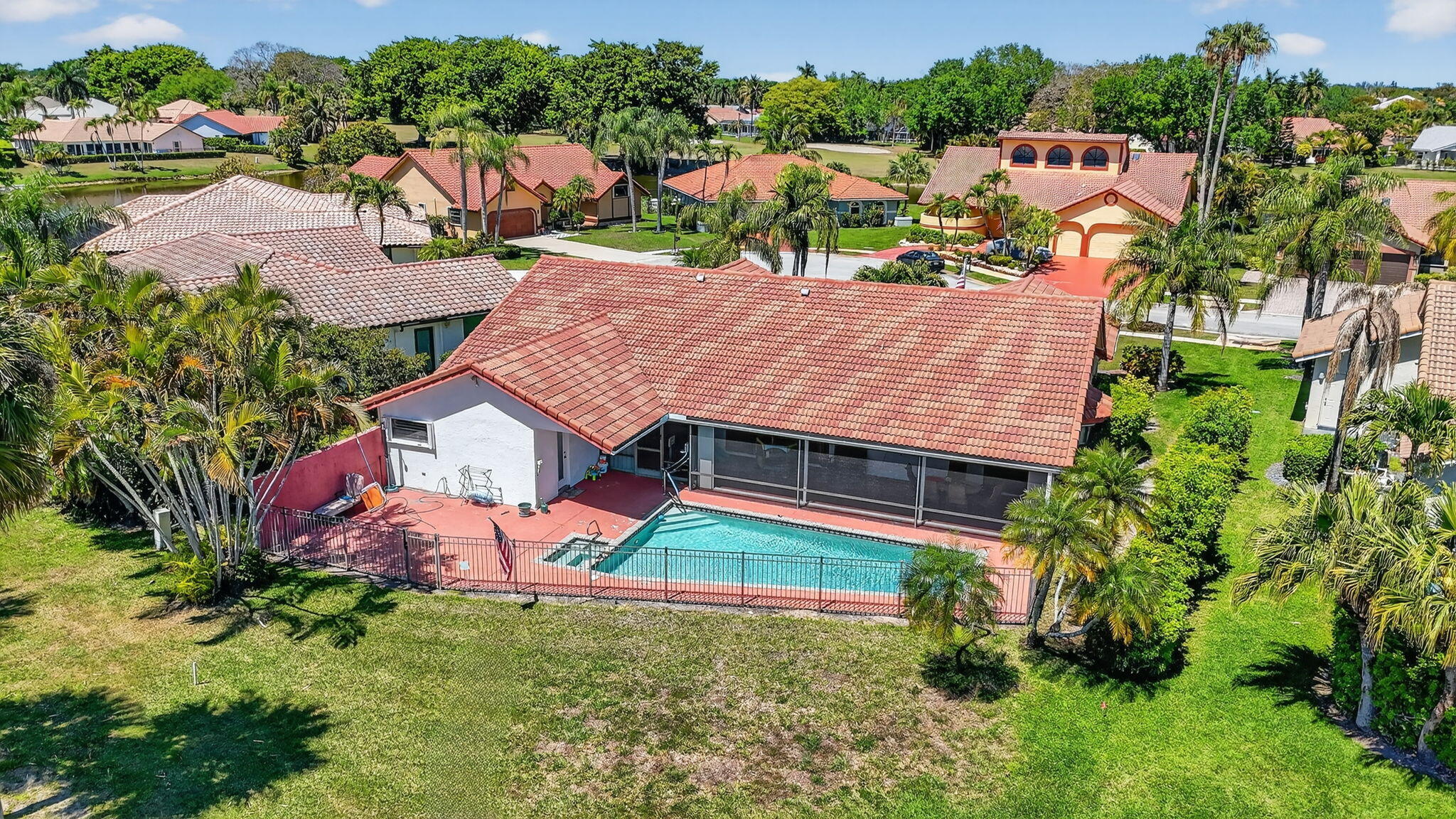 10226 Fresh Meadow Lane Boca Raton, FL 33498 - Photo 58 of 58 an aerial view of residential houses with outdoor space and lake view