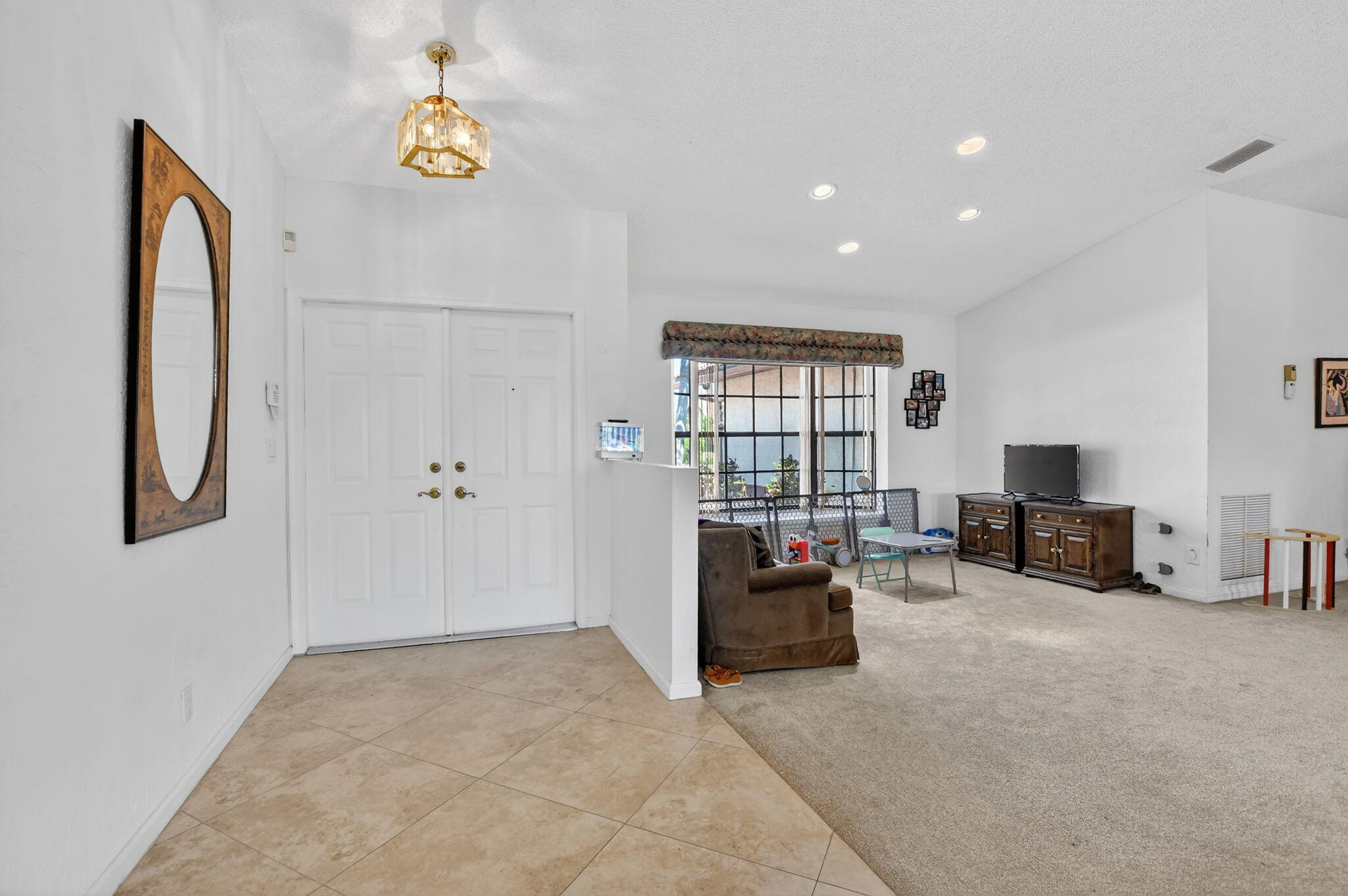 10226 Fresh Meadow Lane Boca Raton, FL 33498 - Photo 6 of 58 a view of livingroom with furniture and a couch