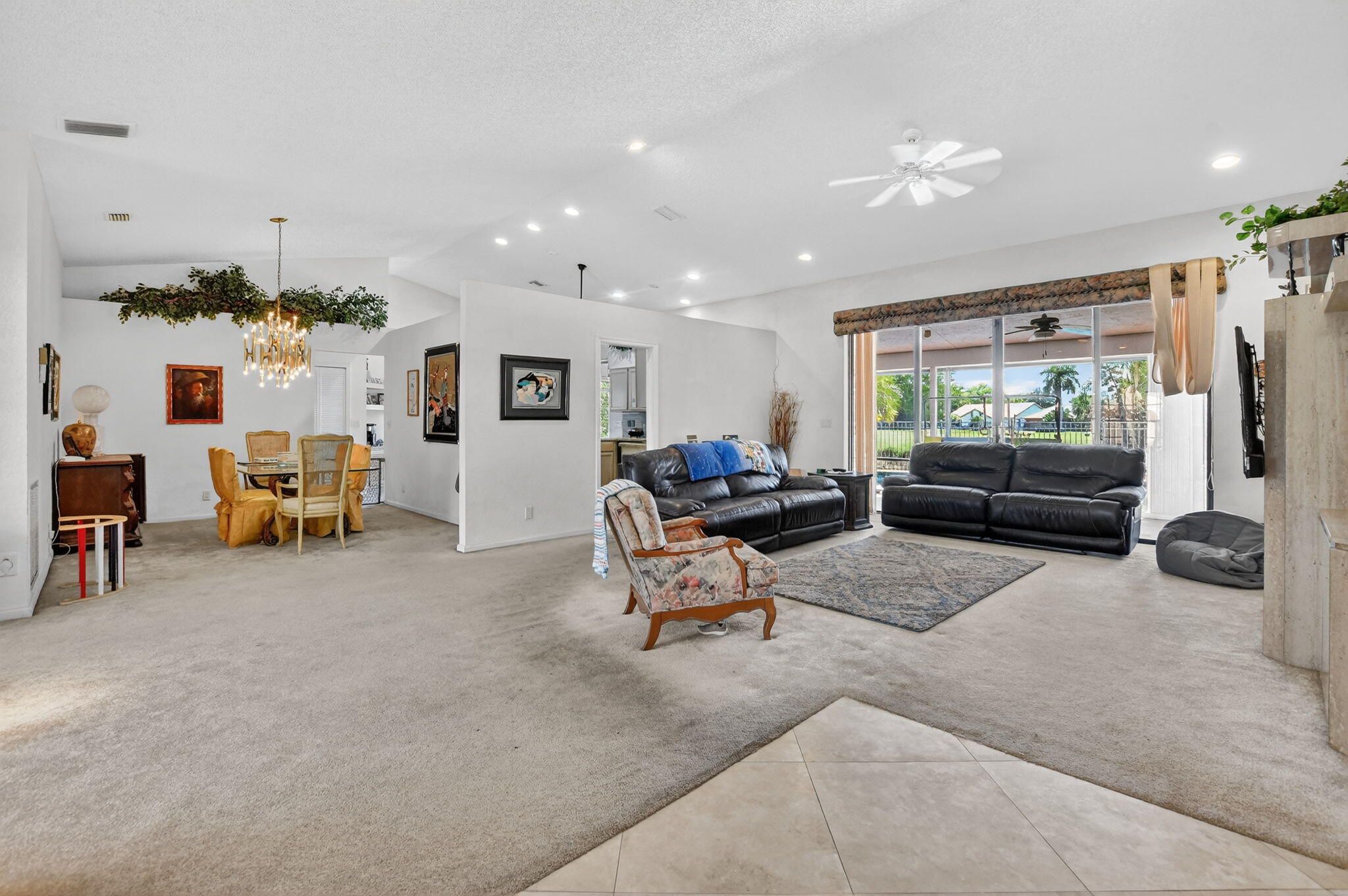 10226 Fresh Meadow Lane Boca Raton, FL 33498 - Photo 7 of 58 a living room with furniture and a flat screen tv