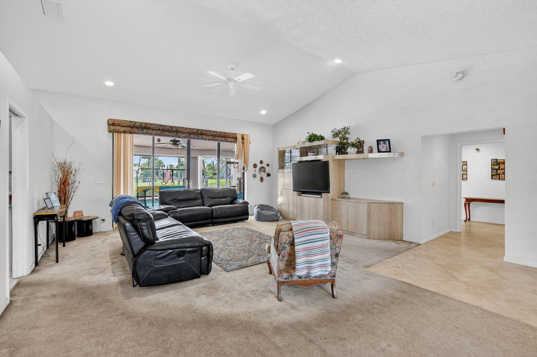 10226 Fresh Meadow Lane Boca Raton, FL 33498 - Photo 9 of 58 a living room with furniture and a flat screen tv