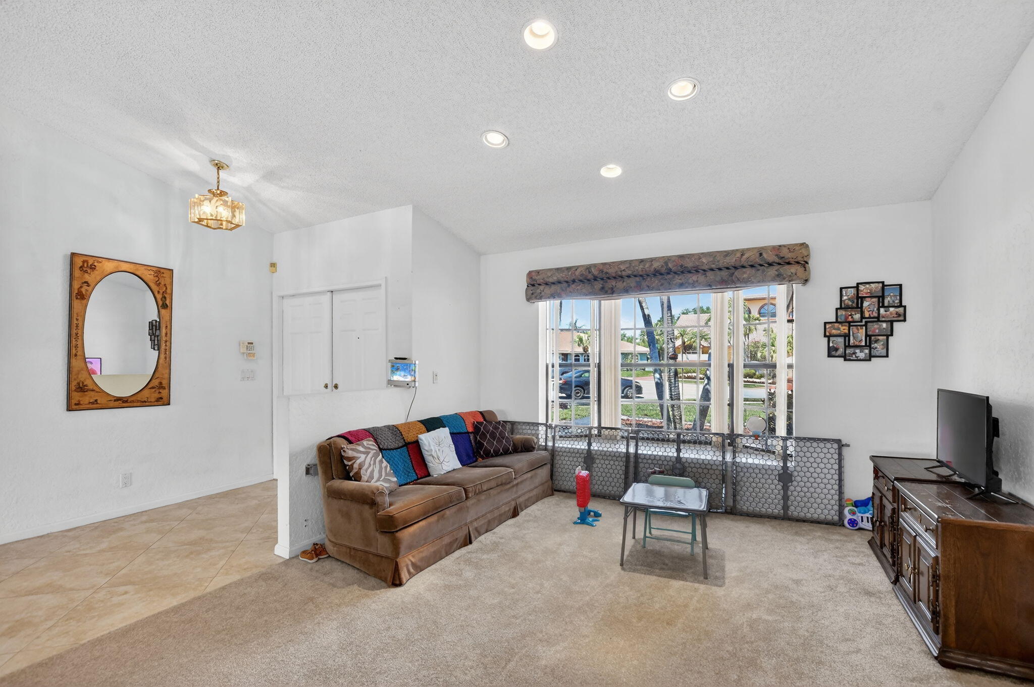 10226 Fresh Meadow Lane Boca Raton, FL 33498 - Photo 10 of 58 a living room with furniture and a flat screen tv