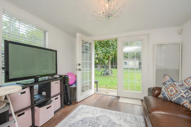 a living room with furniture and a flat screen tv