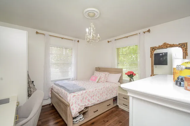 a bedroom with a bed and a table in it